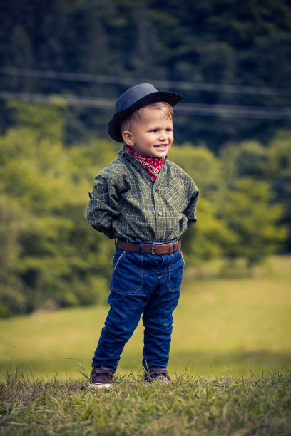 istock Little Cute Boy in Western Costume 2081623635