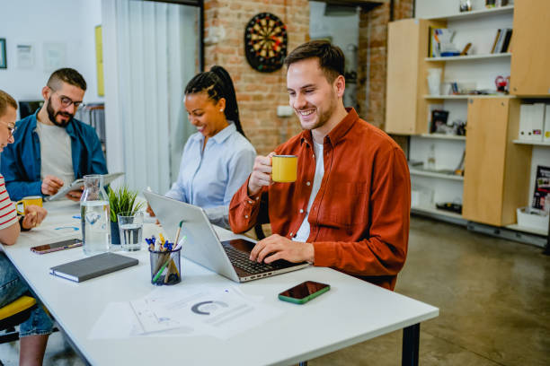 istock Man working on a laptop in a co-working space 2081642746