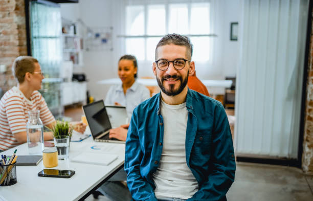 istock Smiling man in the office 2081659107