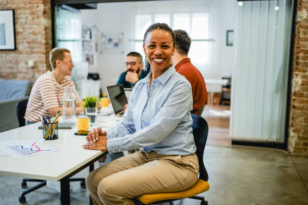 istock Smiling woman in the office 2081663439