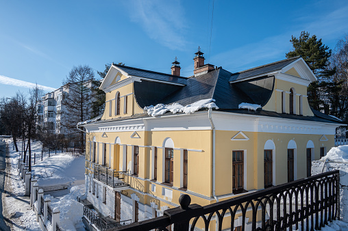 Facade of vintage building. View from bridge. Yaroslavl, Russia - March 3, 2024.