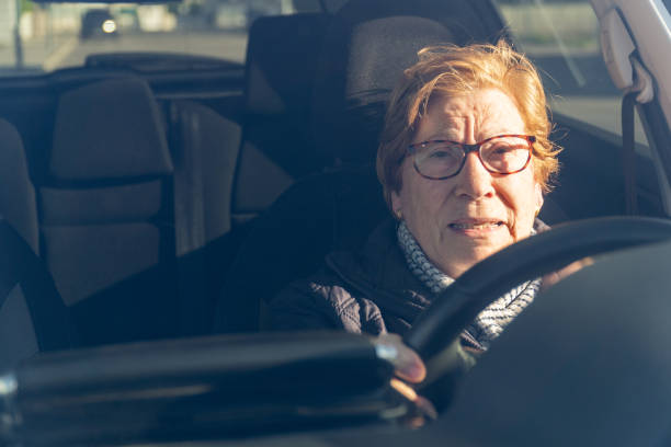 istock Elderly woman driving a car. 2081678365