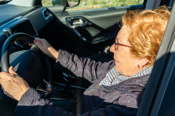 istock Elderly woman driving a car 2081678370