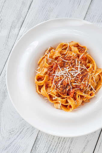 Portion of Tagliatelle pasta with bolognese sauce