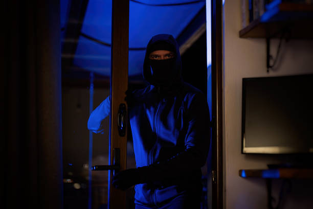 istock The thief breaks into the house through the balcony. 2081719203