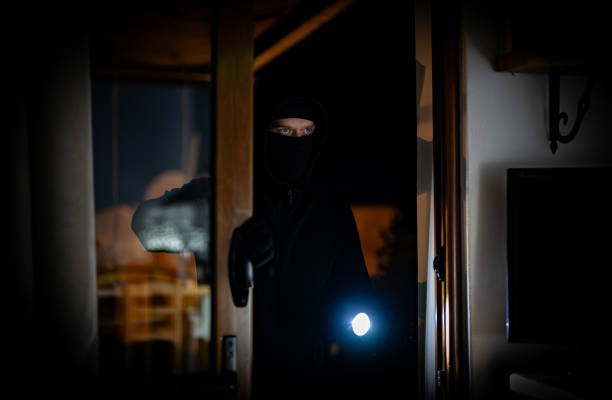 istock The thief breaks into the house through the balcony. 2081719210