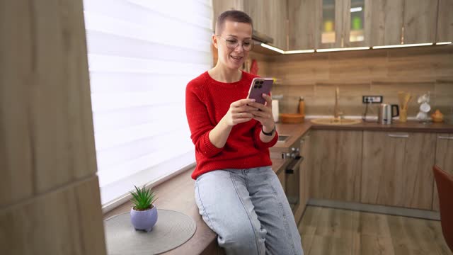 Caucasian woman using phone at home