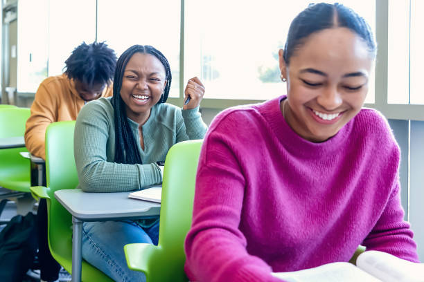 istock Diverse group of college students sitting in classroom 2081733773