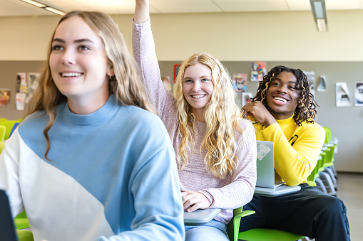Diverse group of college students sitting in classroom