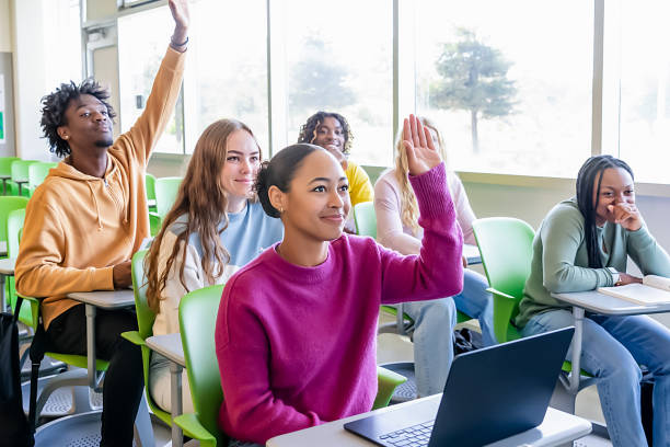 istock Diverse group of college students sitting in classroom 2081734835