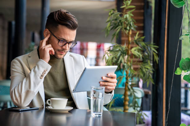 istock Shot of a handsome young businessman looking thoughtful while working on his digital tablet 2081758892