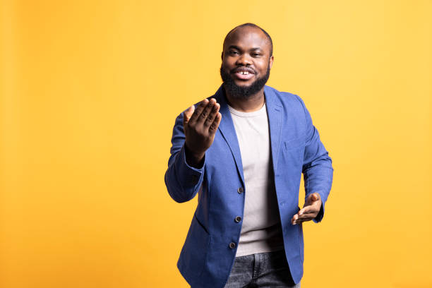 istock Friendly upbeat person calling over someone, studio background 2081760586