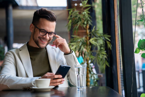 istock Creative young businessman sitting alone in a modern Coffee shop 2081761684