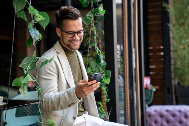 istock Successful businessman sending a text message on his smartphone 2081770327
