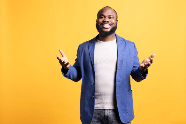 istock Portrait of jovial man posing with hands spread, studio background 2081770329