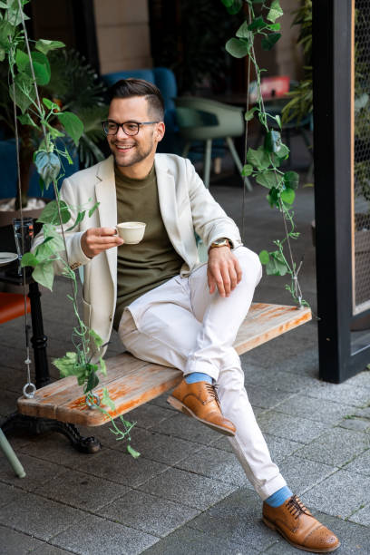 istock Handsome stylish man drinking coffee outdoors 2081770871