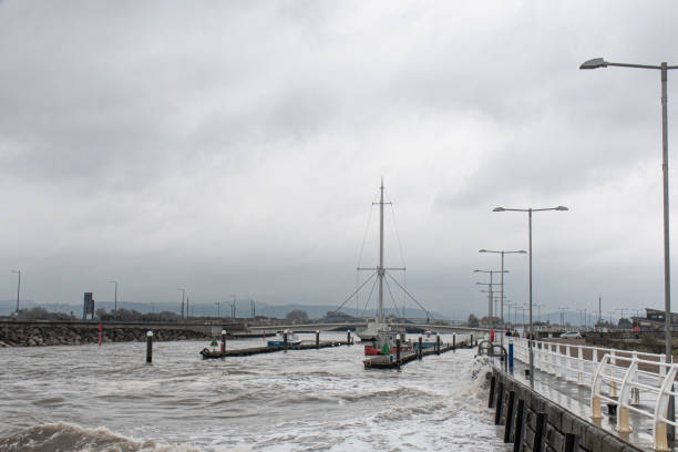 istock Rhyl harbour bridge with rough sea 2081776843