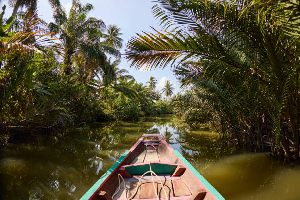 istock A longtail boat floats on a canal in Surat Thani 2081777375