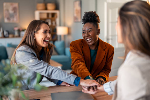 istock International business women showing unity. Teamwork concept 2081778972