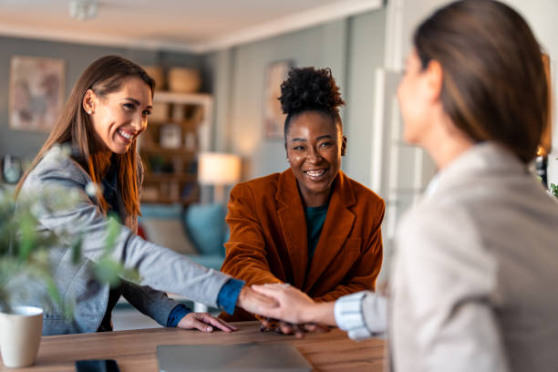 istock International business women showing unity 2081779003