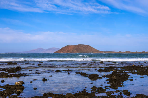 Fuerteventura, Canary islands, Spain: panoramic view of beach of Grandes Playas (The Big Beaches), one of the famous beaches for kitesurfing and windsurfing with Lobos Island on the backround