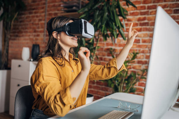 istock Young woman wearing VR headset 2081827965