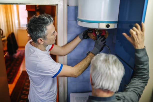 istock electrician fixing the boiler 2081828518
