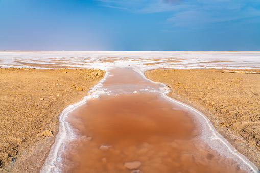 Red salt lake lies between Muscat and Al-Ashkhara, often home flamingos and other birds. It is in desert area.