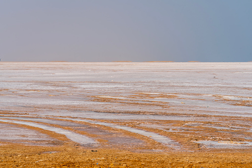 Red salt lake lies between Muscat and Al-Ashkhara, often home flamingos and other birds. It is in desert area.