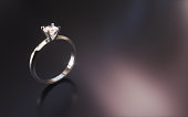 Single Stone Diamond Ring on Black Gradient Background