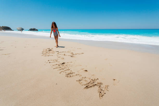 Beautiful little girl playing on the beach in Hurghada in Egypt.