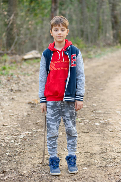 istock Child and nature. A beautiful boy in the forest. 2081922484