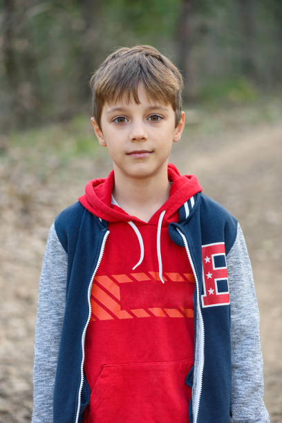 istock Child and nature. A beautiful boy in the forest. 2081923523