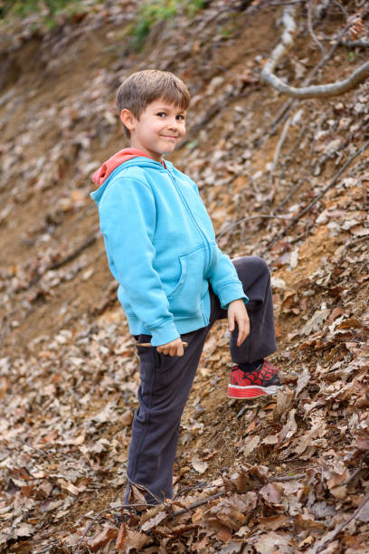 istock Child and nature. A beautiful boy in the forest. 2081924649