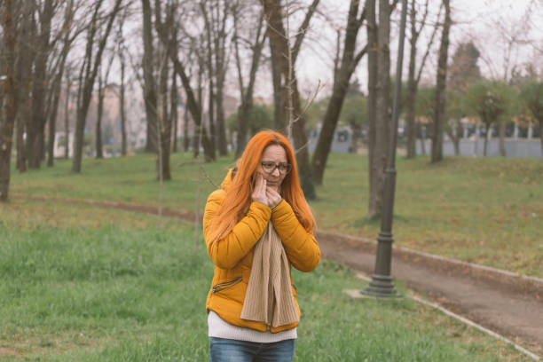 Woman outdoors feeling pain in her tooth