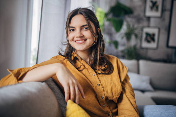 istock Young woman sitting at home 2081943257