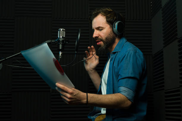 istock Voice actor recording audio in studio 2081962604