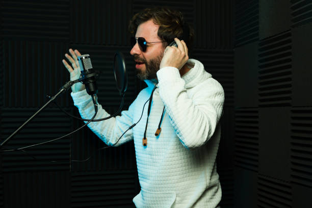 istock Passionate male singer recording in studio 2081964177