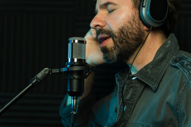 istock Male vocalist recording in studio 2081965778