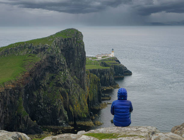 istock Dramatic coastline with tall rocky cliffs and a lighthouse at famous Neist Point 2082006289