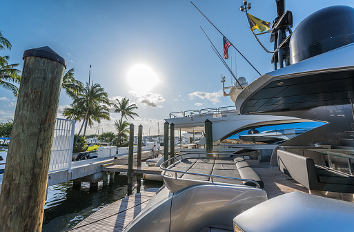 Luxury yachts by Miami  marina on a sunny morning.