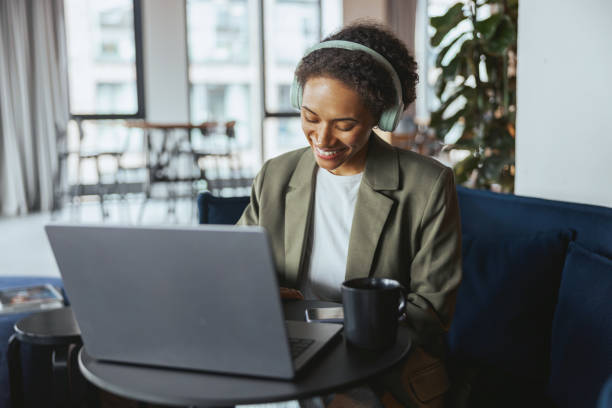 istock Whitecollar worker at a formal event sitting in a room using a laptop computer 2082048335