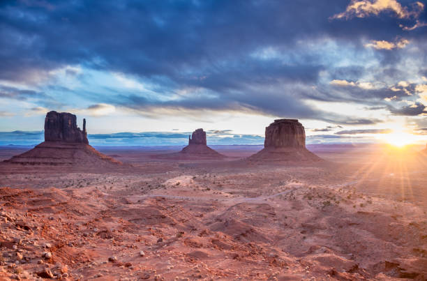 istock Sunrise, Monument Valley, Arizona, looking east into the sun 2082056286