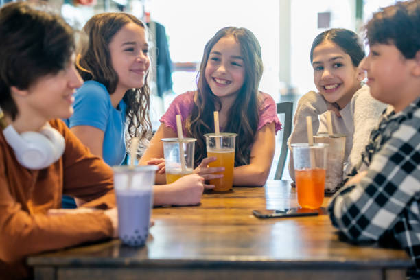 istock Teens Hanging Out in a Cafe 2082171002