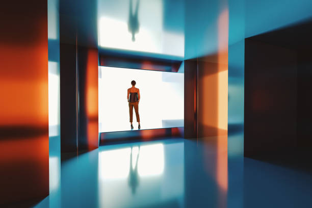 istock Woman standing in futuristic corridor 2082190377