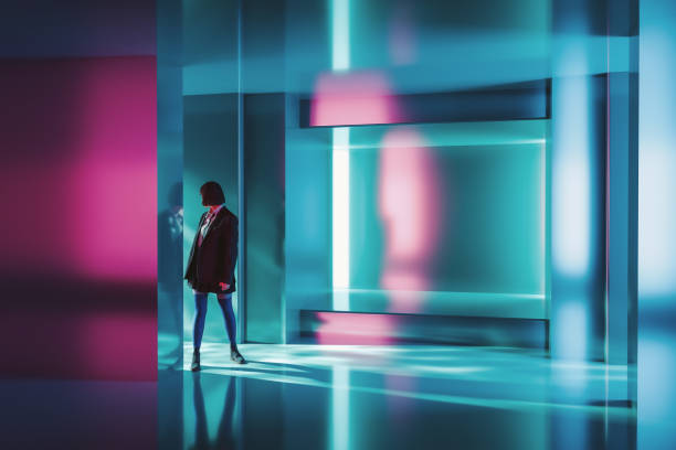 Woman standing in futuristic corridor