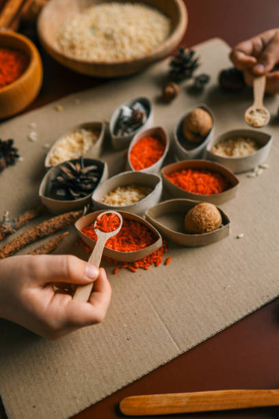 istock Montessori and Sensory Development, A child sorts cereals by color 2082227679