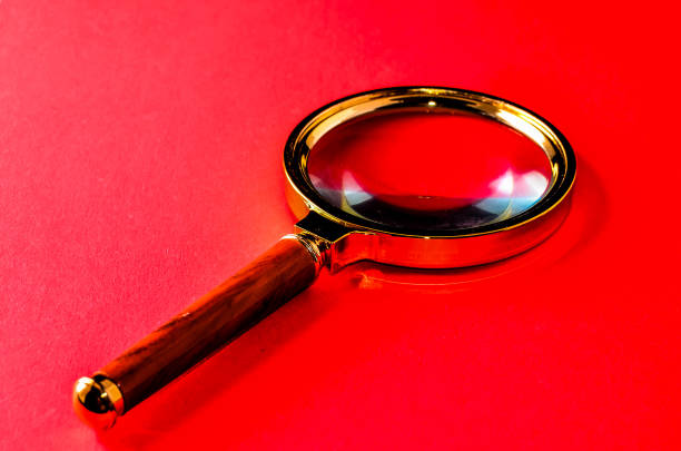 Vintage Magnify Glass Loupe on a Colored Background
