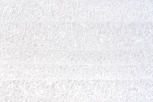 Close-up view of white packaging polyurethane foam material structure high resolution background texture up close, backdrop simple protective material for shipping and handling abstract concept nobody
