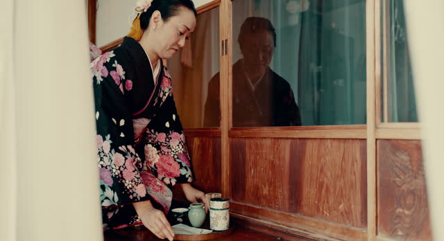 Japanese, tea and traditional woman with service of matcha, ginseng and open door with a tray. Asian, culture and calm master in kimono with respect for hospitality, indigenous heritage and beverage